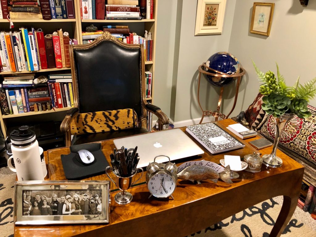Desk with library behind