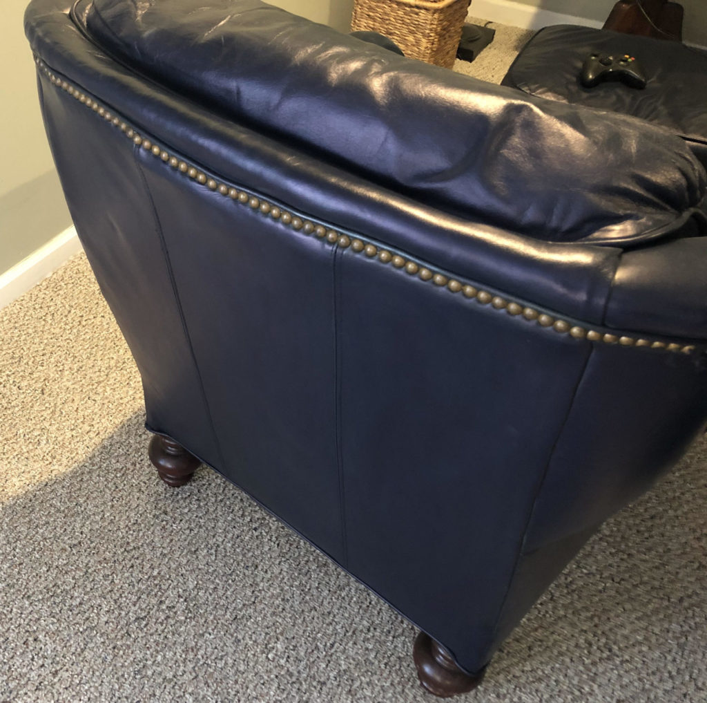 Leather coloring on chair next to nailheads