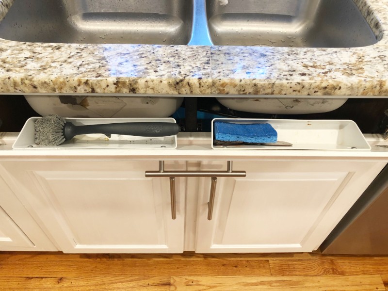 Pull out storage space in front of kitchen sink