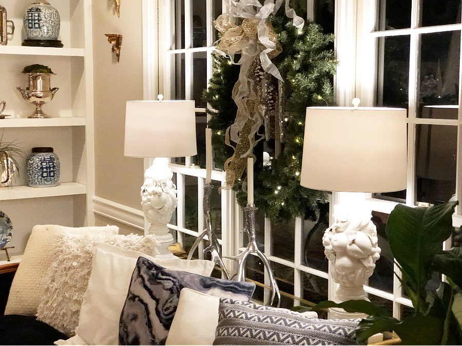Large wreath with fresh greens. Christmas chinoiserie living room.
White fruit lamps.