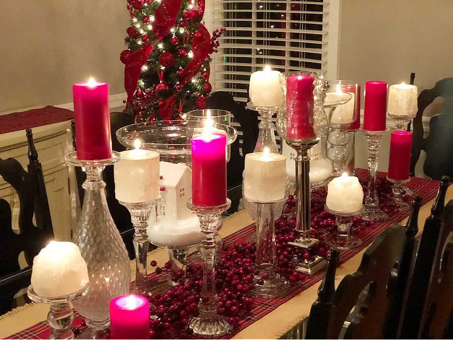 Dining table decorated for Christmas in a bold red