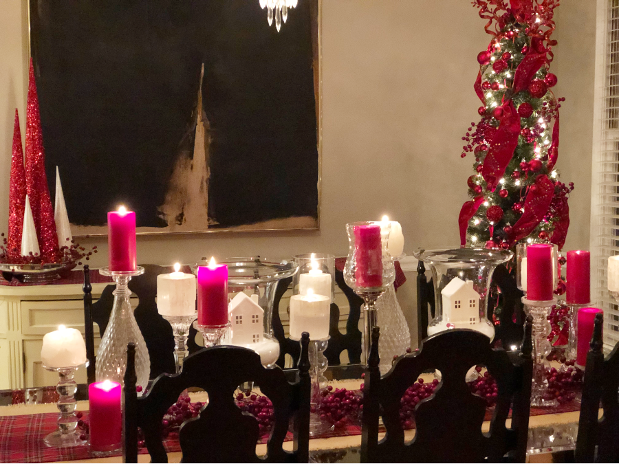 Decorated dining room for Christmas with bold red decor